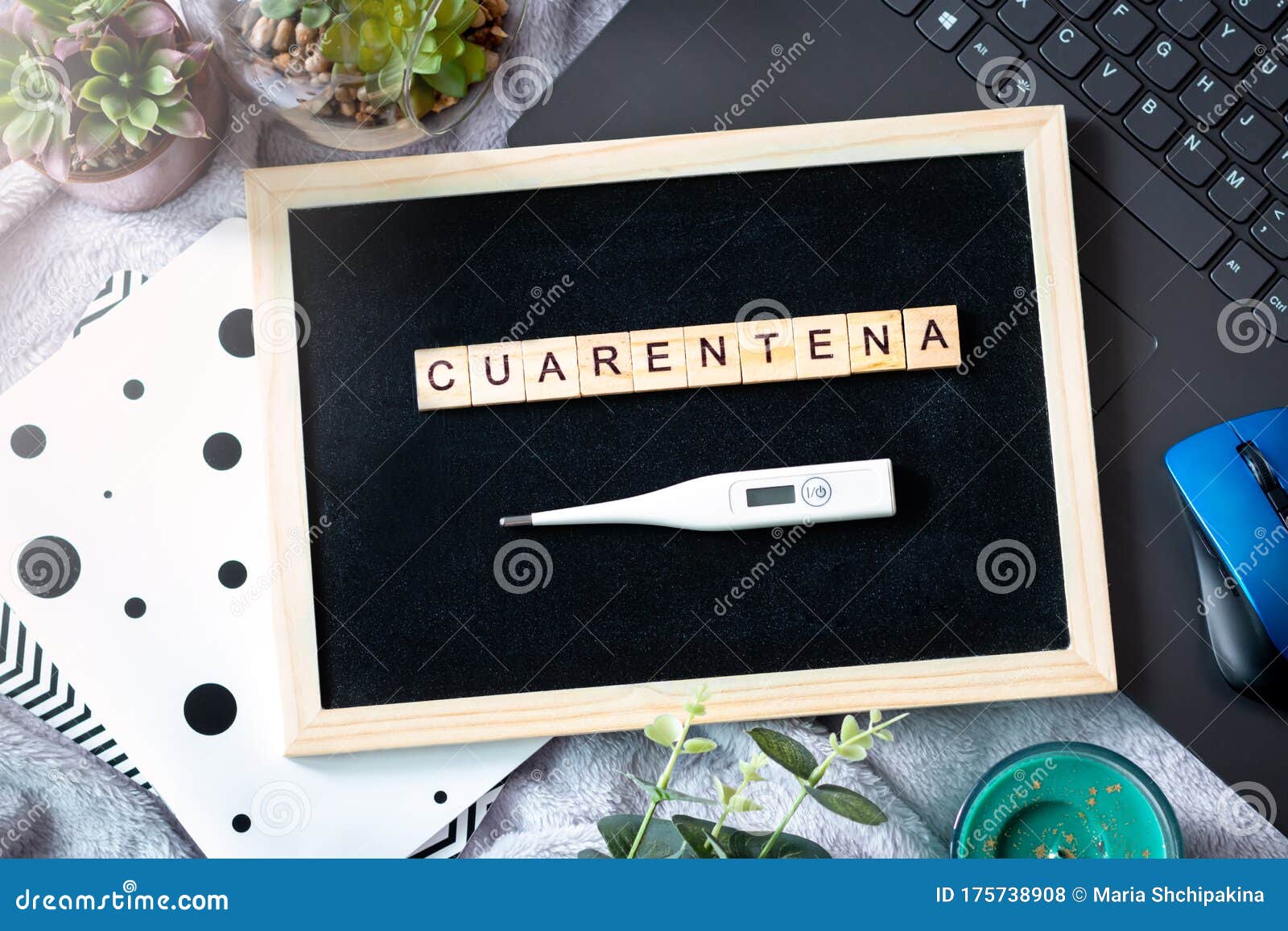 spanish word cuarentena made of wooden blocks, concept of self quarantine at home as preventative measure against virus outbreak.
