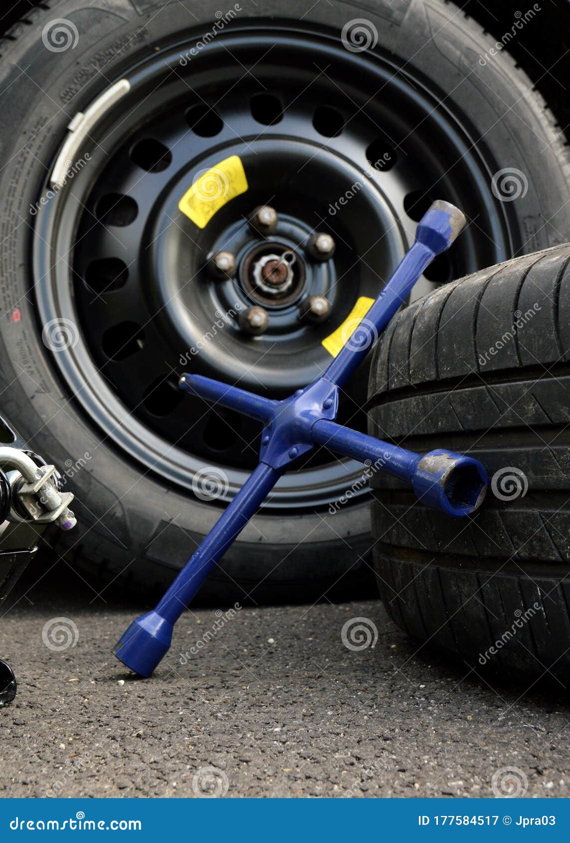 Spare tire and lug wrench stock image. Image of automotive 177584517