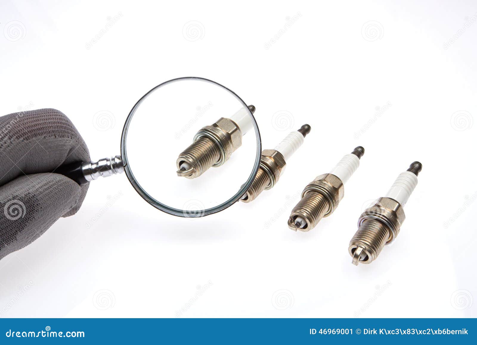 4 Spark Plugs with a Magnifying Glass Stock Image Image of assembly