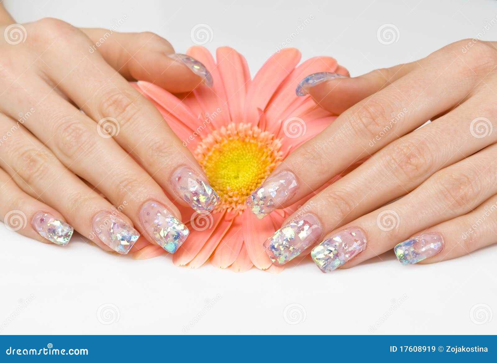 sparkling manicure and a pink flower