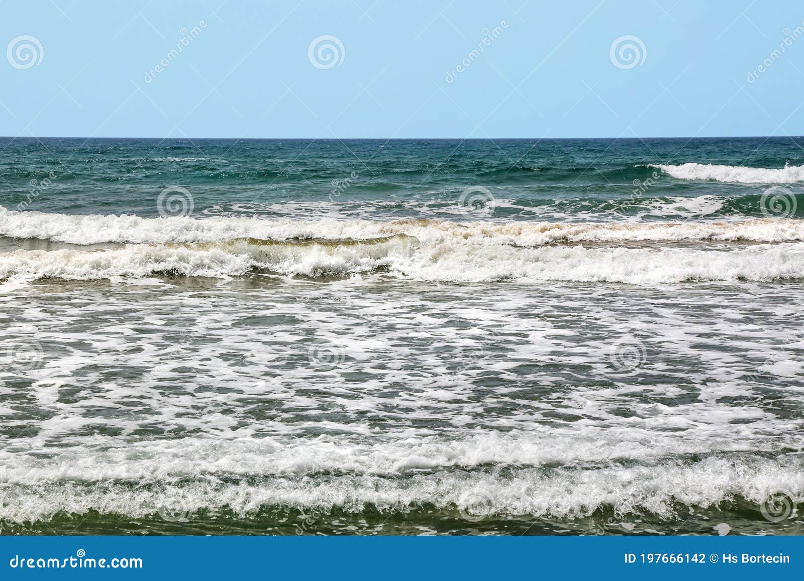 sparkling waves hitting the shore in iztuzu beach of dalyan.