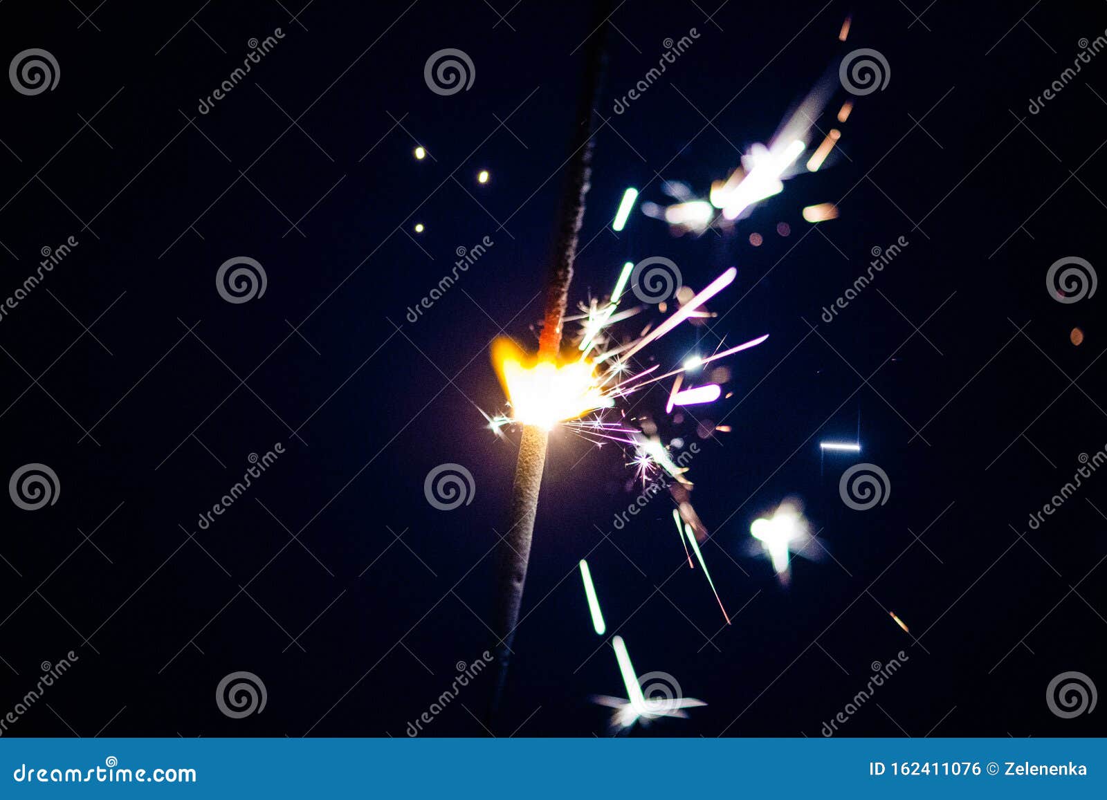 Sparks in the Dark. Sparks. Christmas and New Year Time Stock Photo
