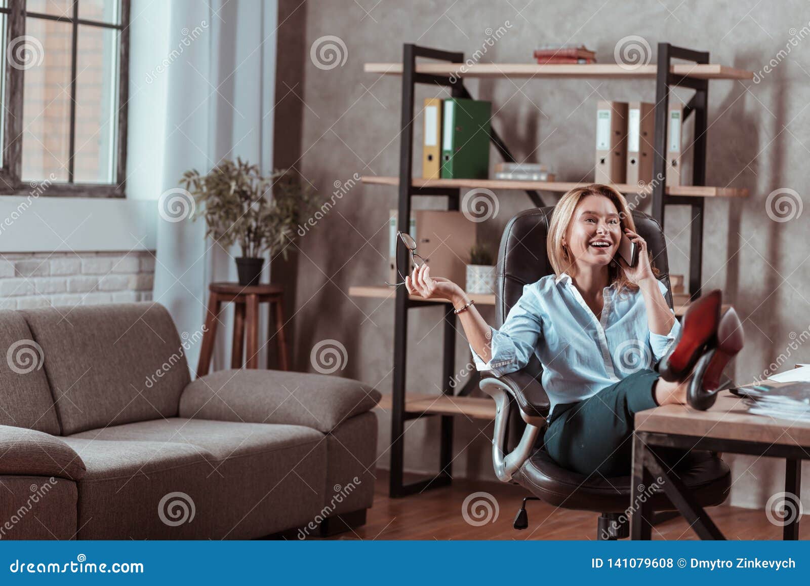 Businesswoman Wearing High-heeled Shoes Speaking on the Phone Stock ...