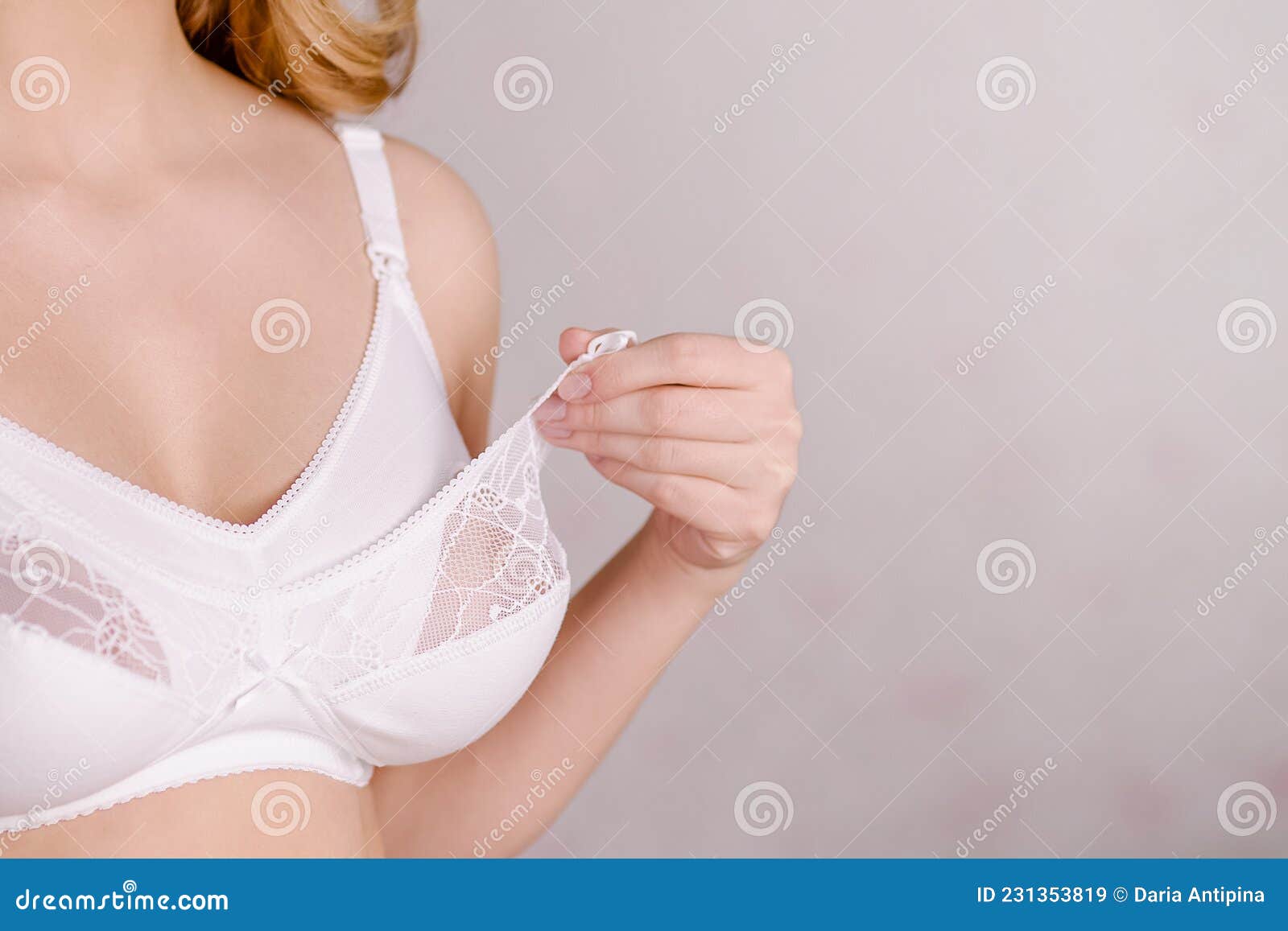 White Lacery Lingerie Near Lipstick and Necklace on Pink