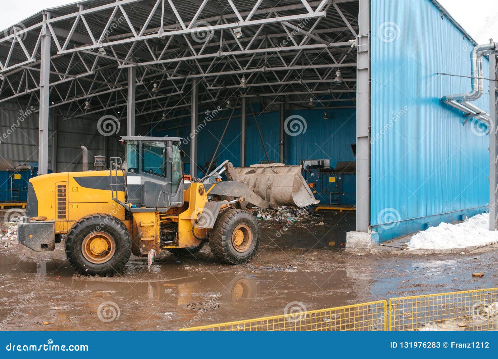 special machinery or bulldozer work on the site of waste unloading at the plant for waste disposal.