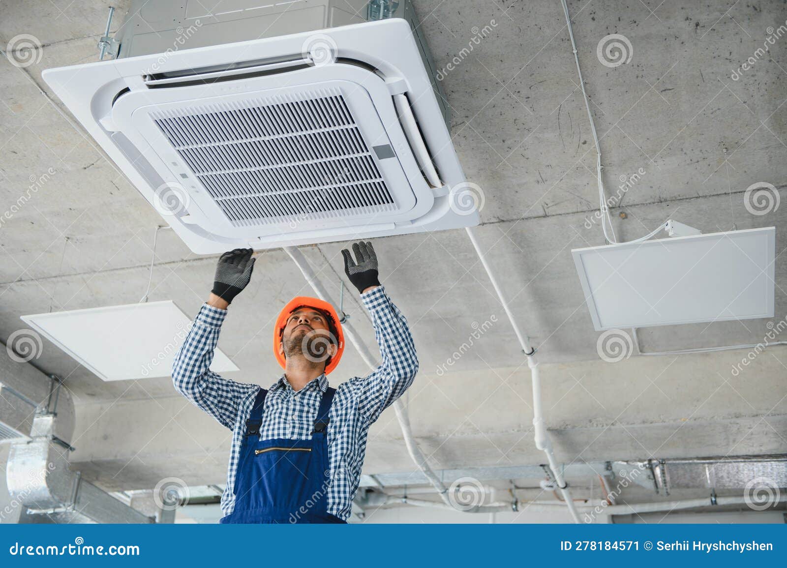 Specialist Cleans and Repairs the Wall Air Conditioner Stock Image Image of workwear