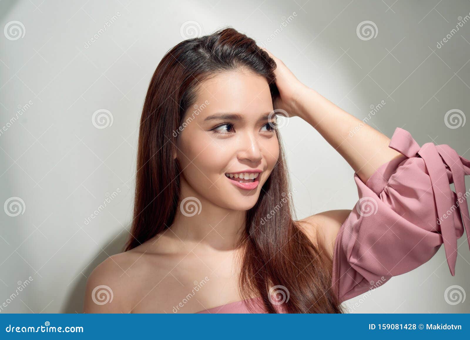 Spectacular Asian Young Woman Playing With Her Hair Indoor Photo Of 