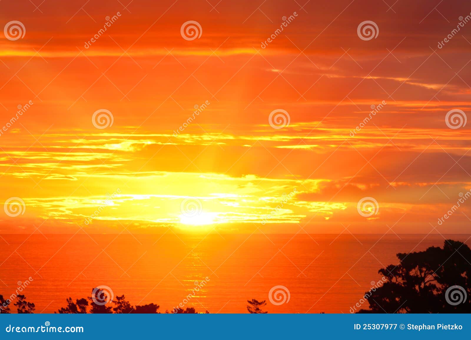 spectacular dramatic orange sunset over the ocean