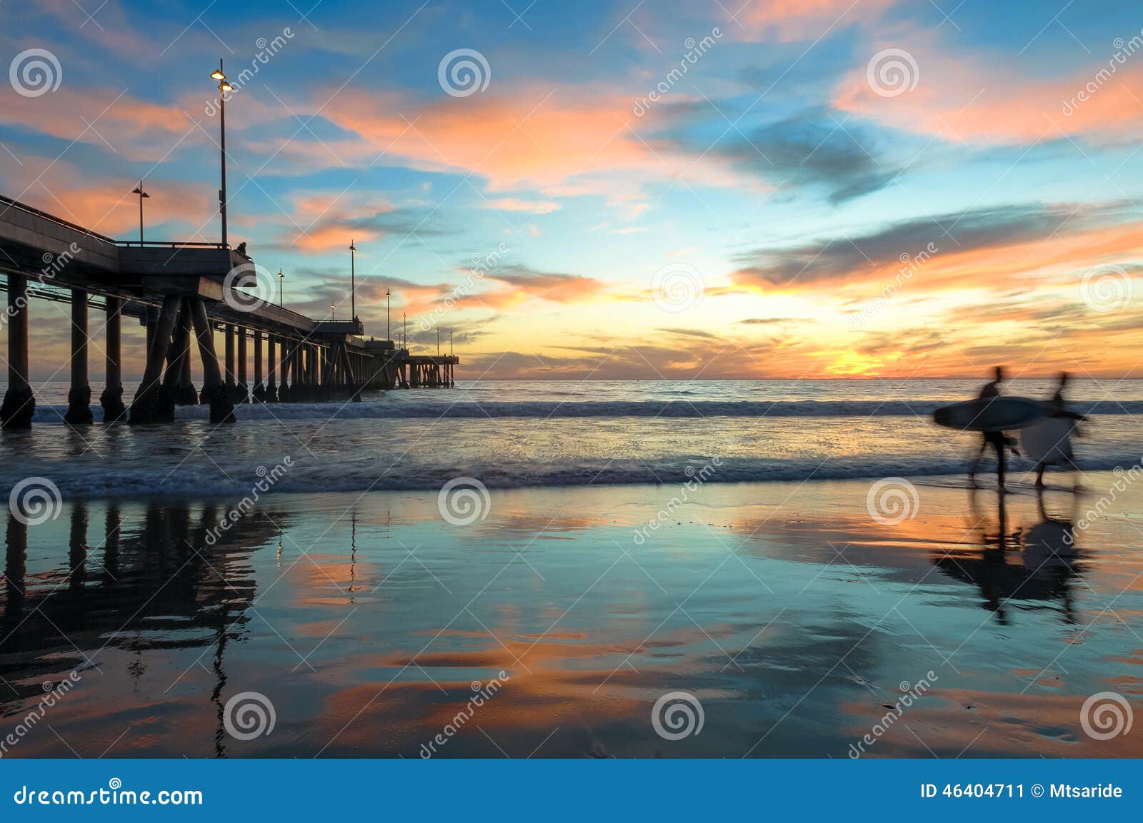 spectacular sunset with surfers at venice beach