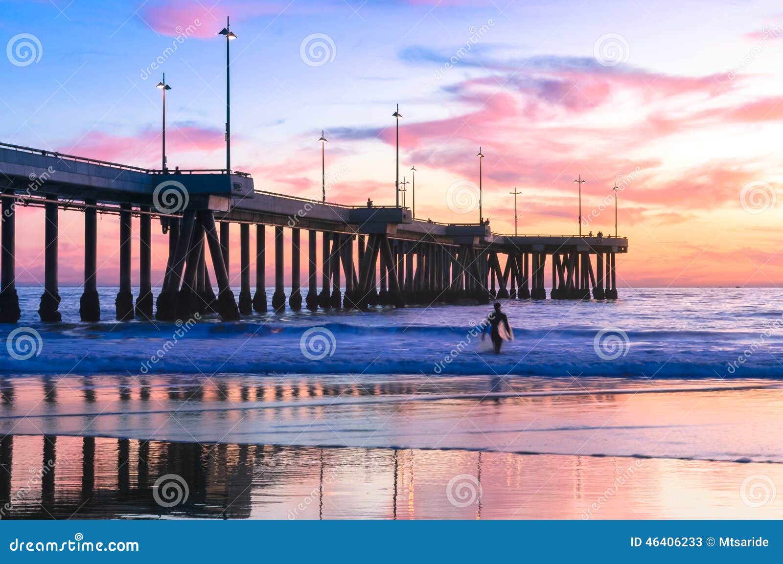 spectacular sunset with surfers at venice beach