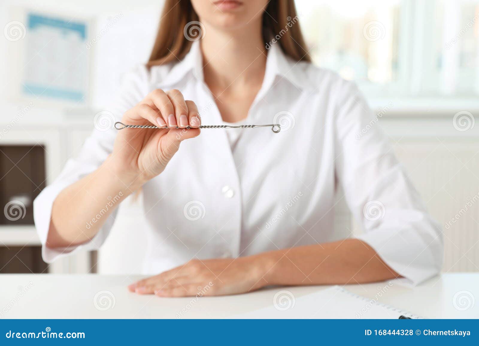 speech therapist with logopedic probe in clinic