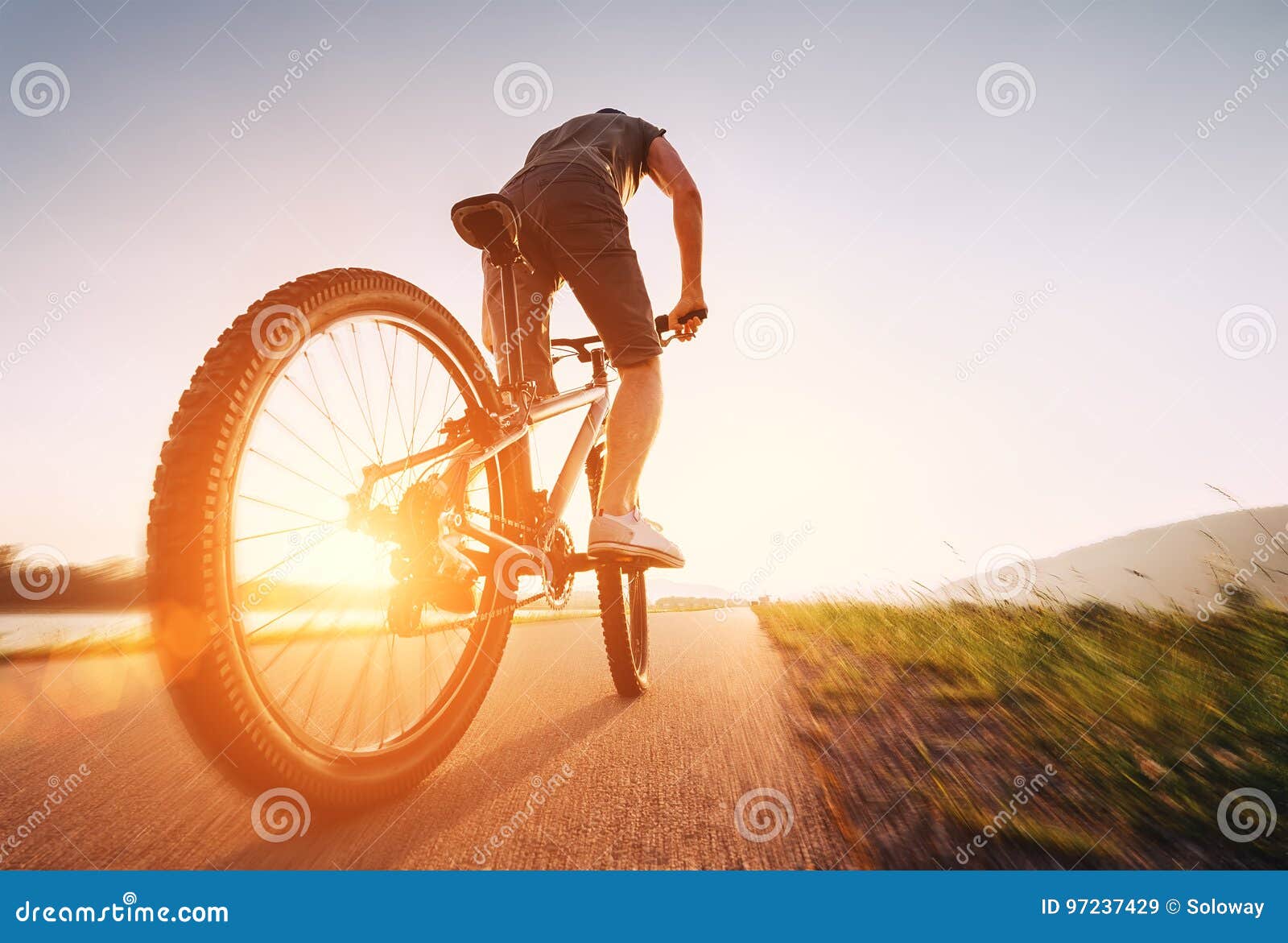 speedy bicyclist on a sunny afternoon