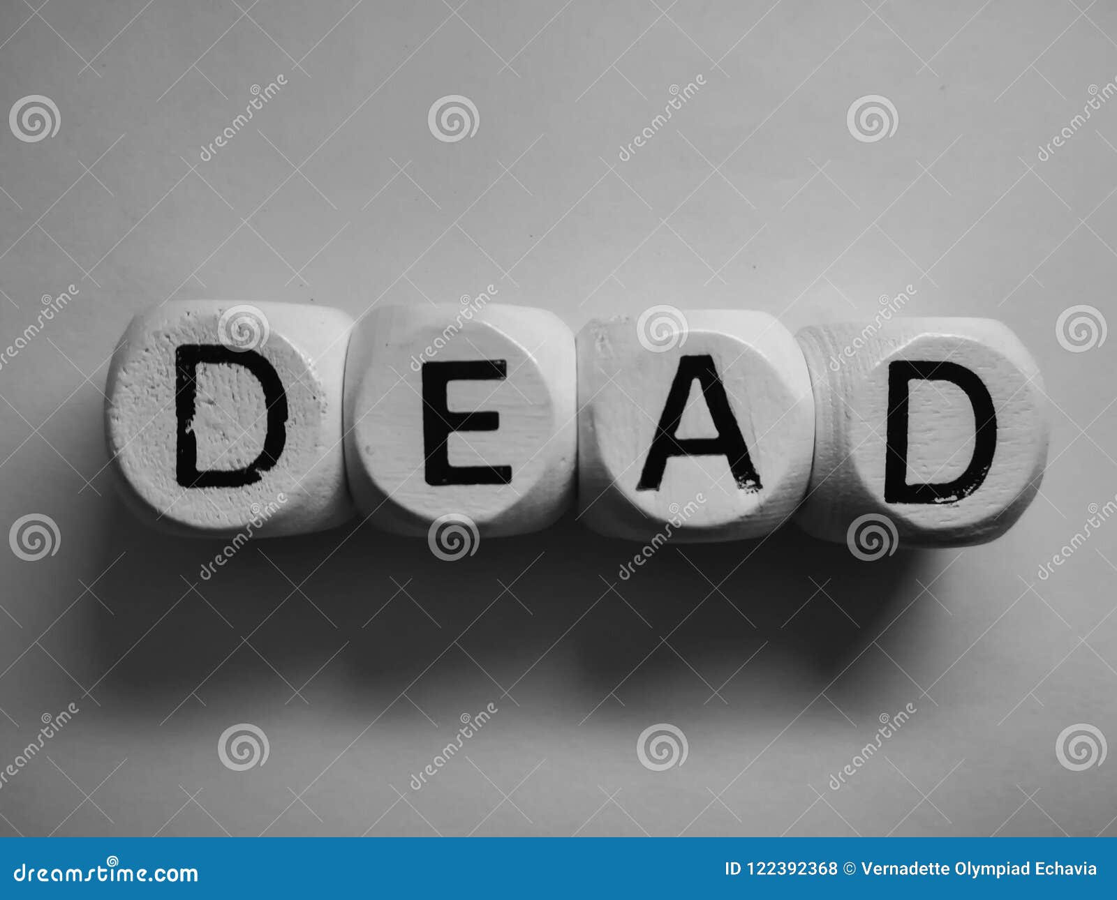 Word dead spelled on dice stock photo. Image of typography 122392368
