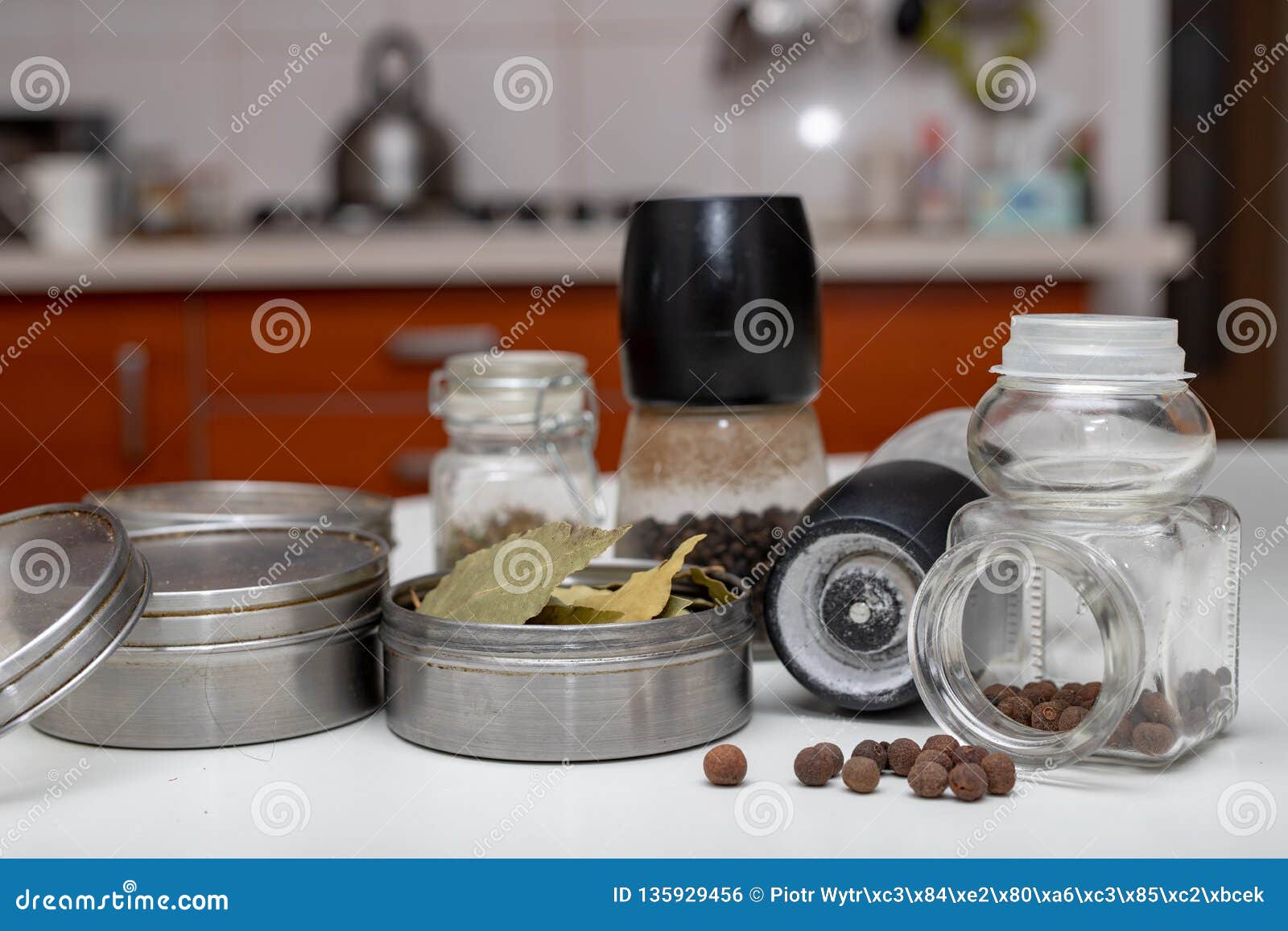 Spices In Containers On The Kitchen Table. Equipment In The Home