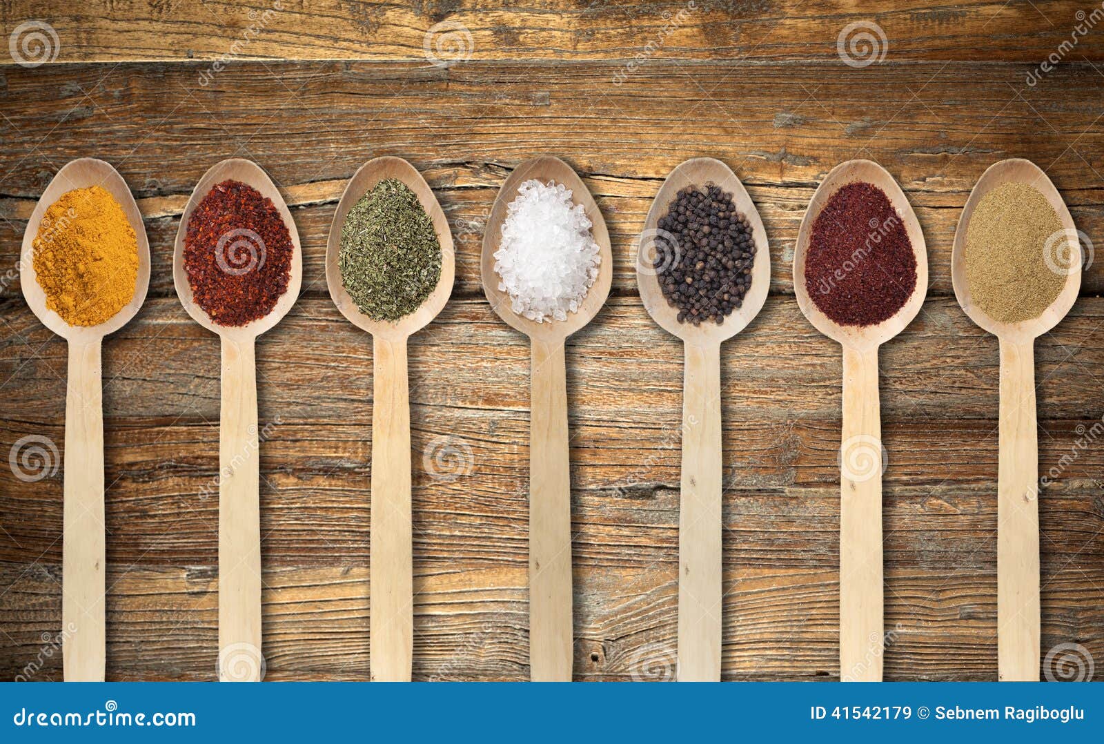 Spices on wooden spoon stock image. Image of macro, pepper 41542179