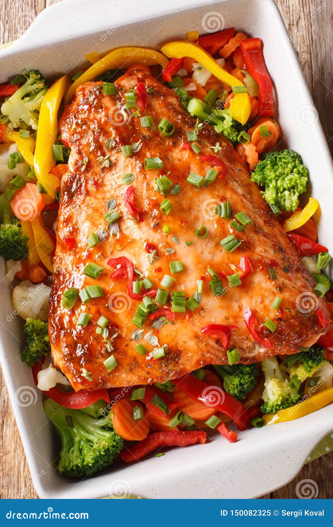 Spicy Baked Salmon Fillet with Vegetables and Herbs Close-up in a ...