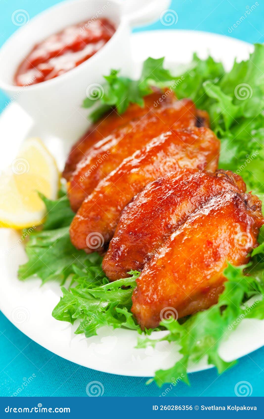 Spicy chicken wings stock photo. Image of food, green 260286356