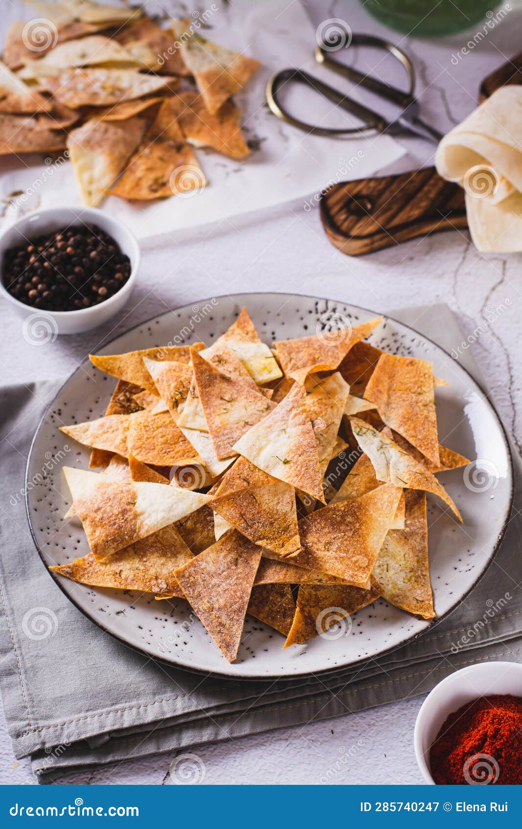 Spicy Chips with Paprika and Dill from Tortilla on a Plate Vertical