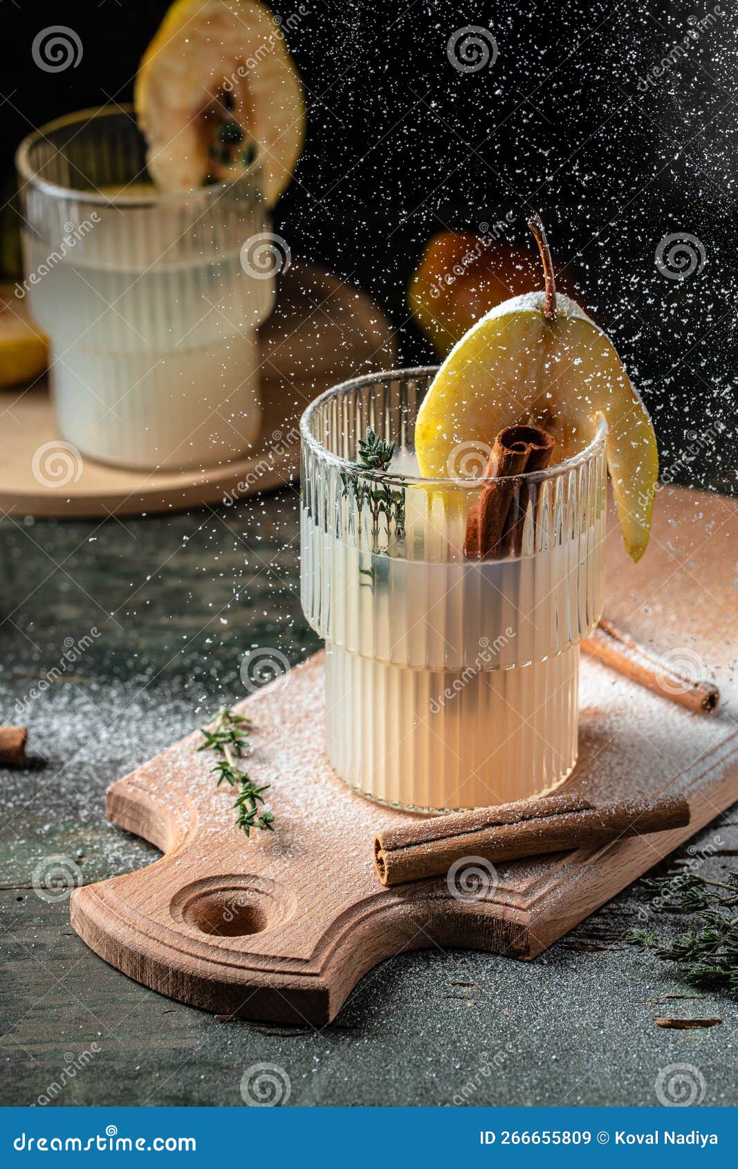 Spicy Cocktail with Pears and Thyme. Mulled Wine. Vertical Image. Top