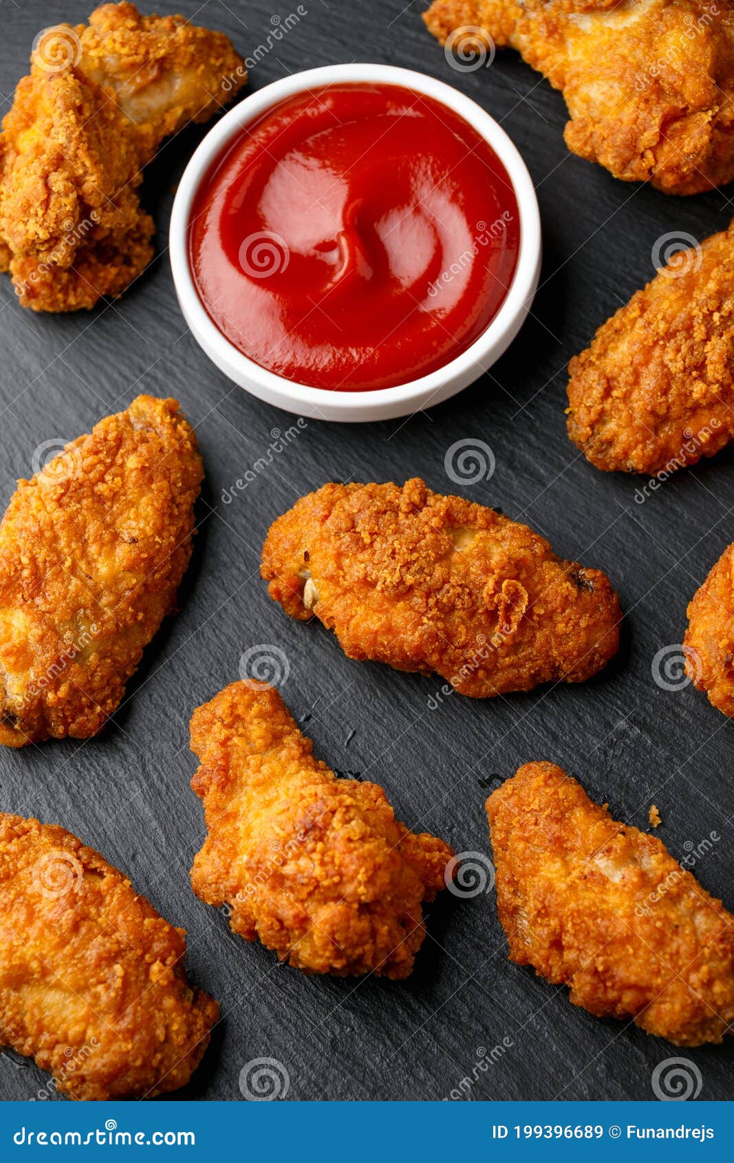 Spicy Deep Fried Chicken Wings with Ketchup on Stone Board Stock Image