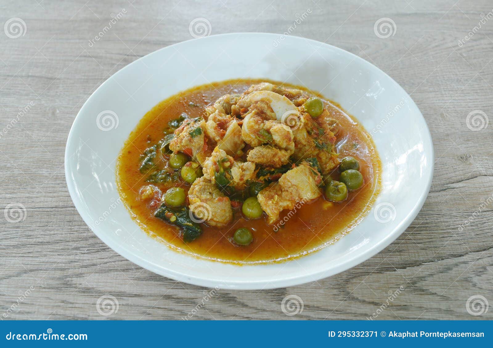 Spicy Fried Pork Bone with Eggplant in Coconut Milk Curry on Plate