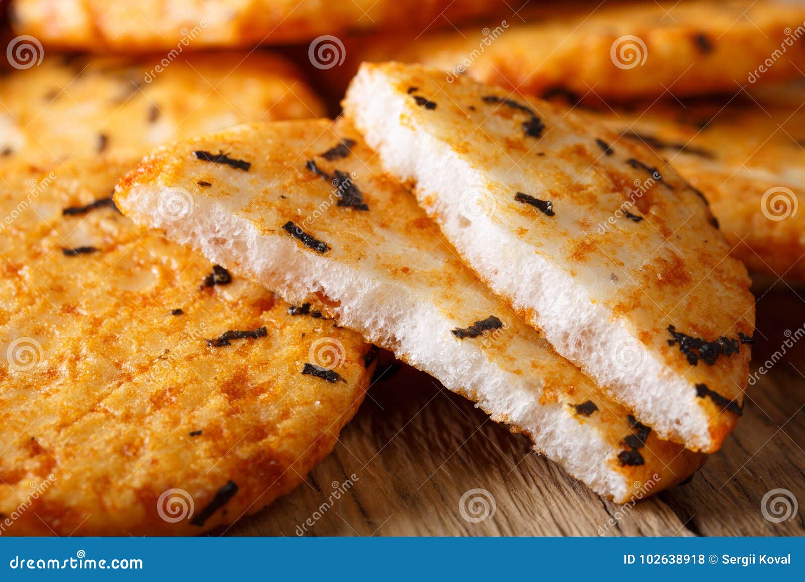 Spicy Rice Cracker with Seaweed Macro on the Table. Horizontal Stock