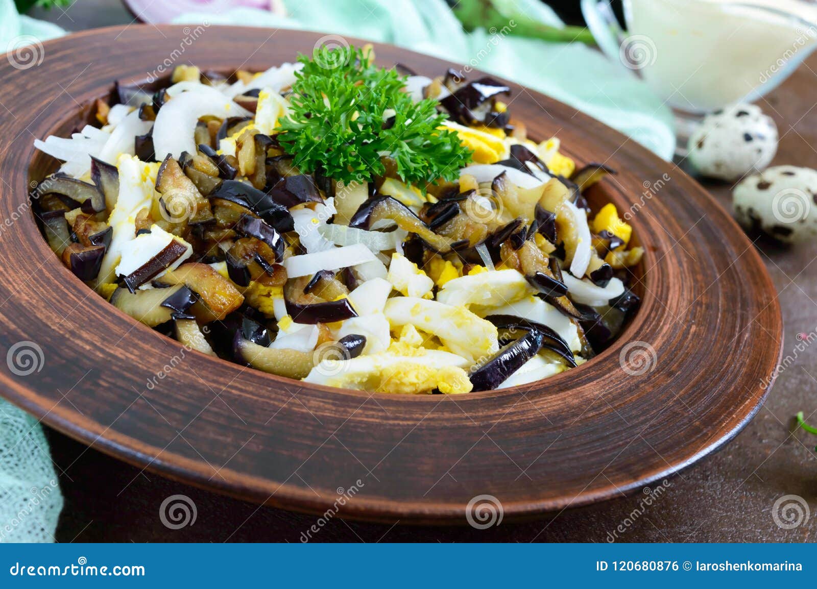 Spicy Salad of Fried Eggplant, Boiled Egg, Marinated Onions in a Bowl