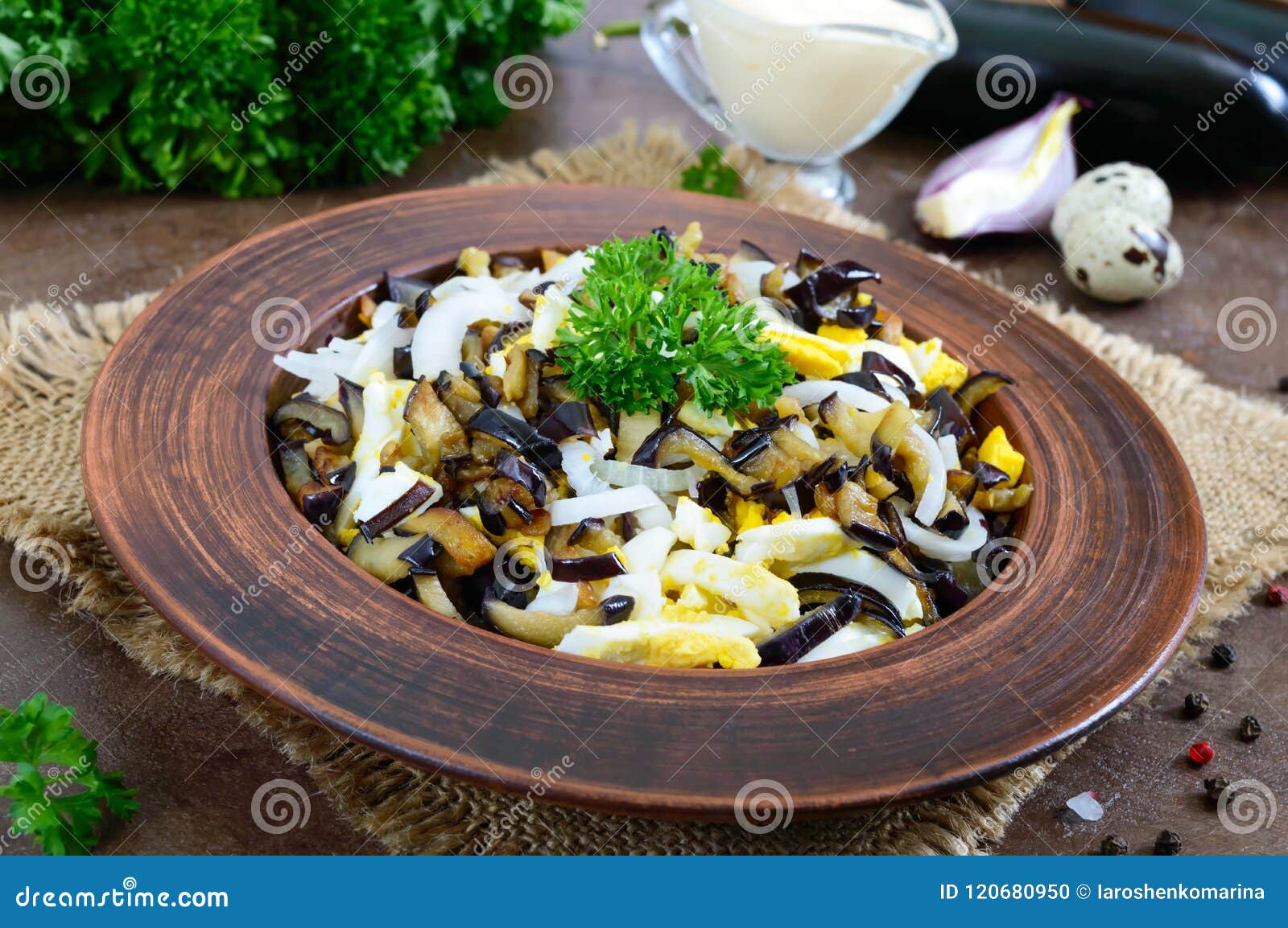 Spicy Salad of Fried Eggplant, Boiled Egg, Marinated Onions in a Bowl