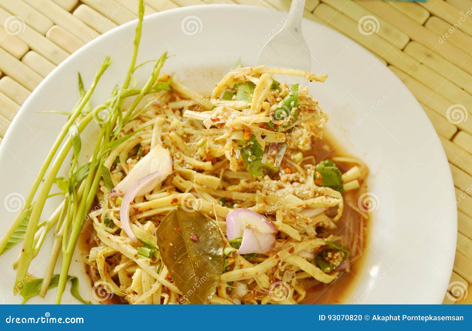 Spicy Shredded Bamboo Shoot Salad in Thai Northeastern Style Scooping