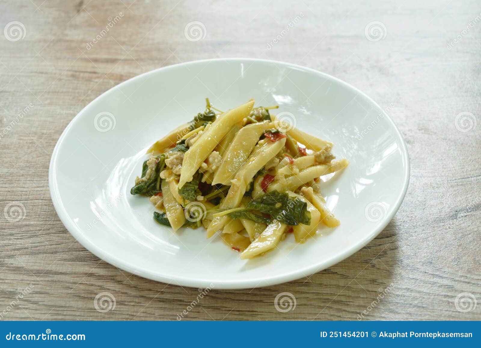 Spicy Stir Fried Bamboo Shoot and Chop Pork with Basil Leaf on Plate