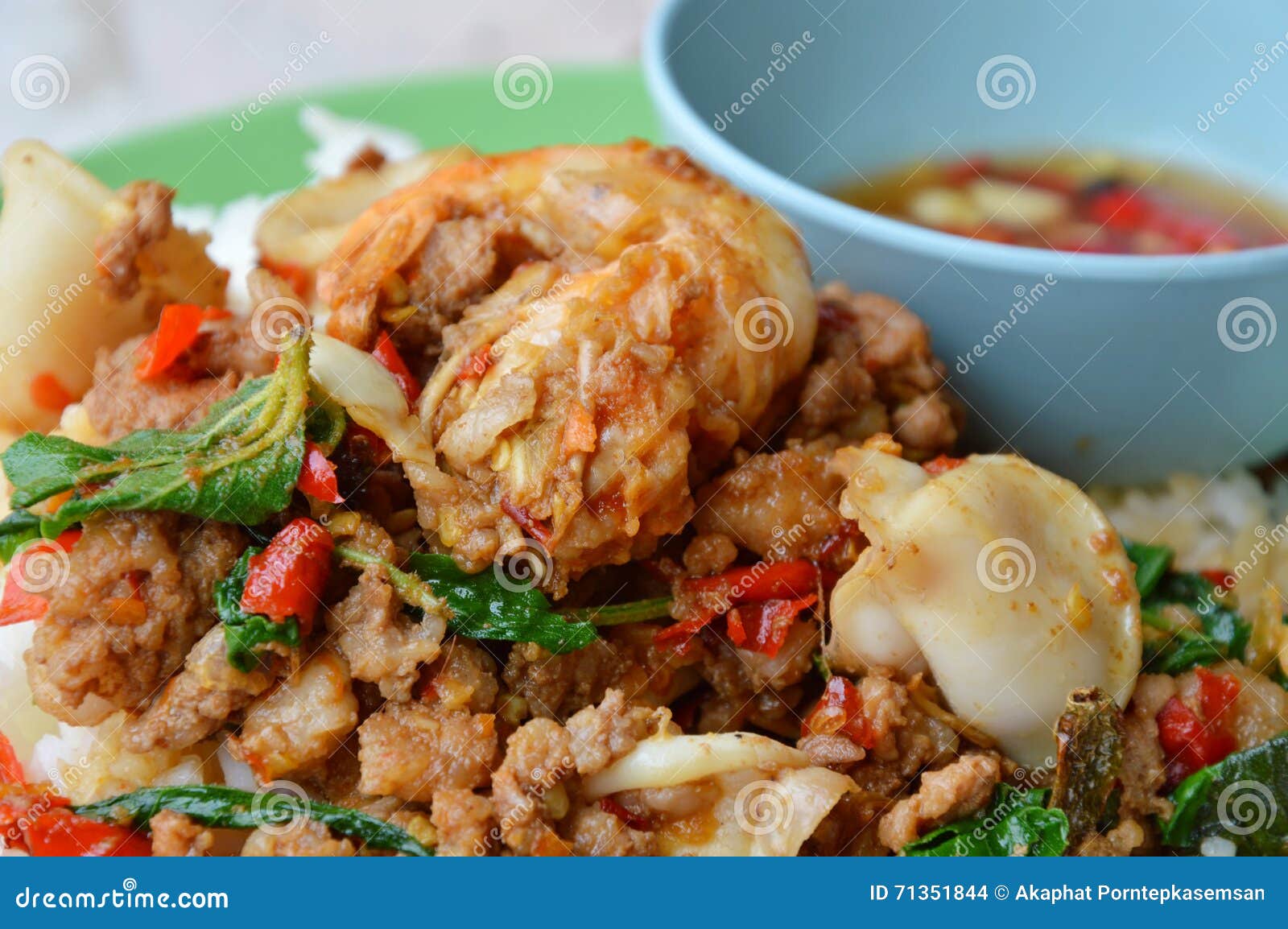 Spicy Stir-fried Mixed Seafood and Chop Pork with Basil Leaf on Rice
