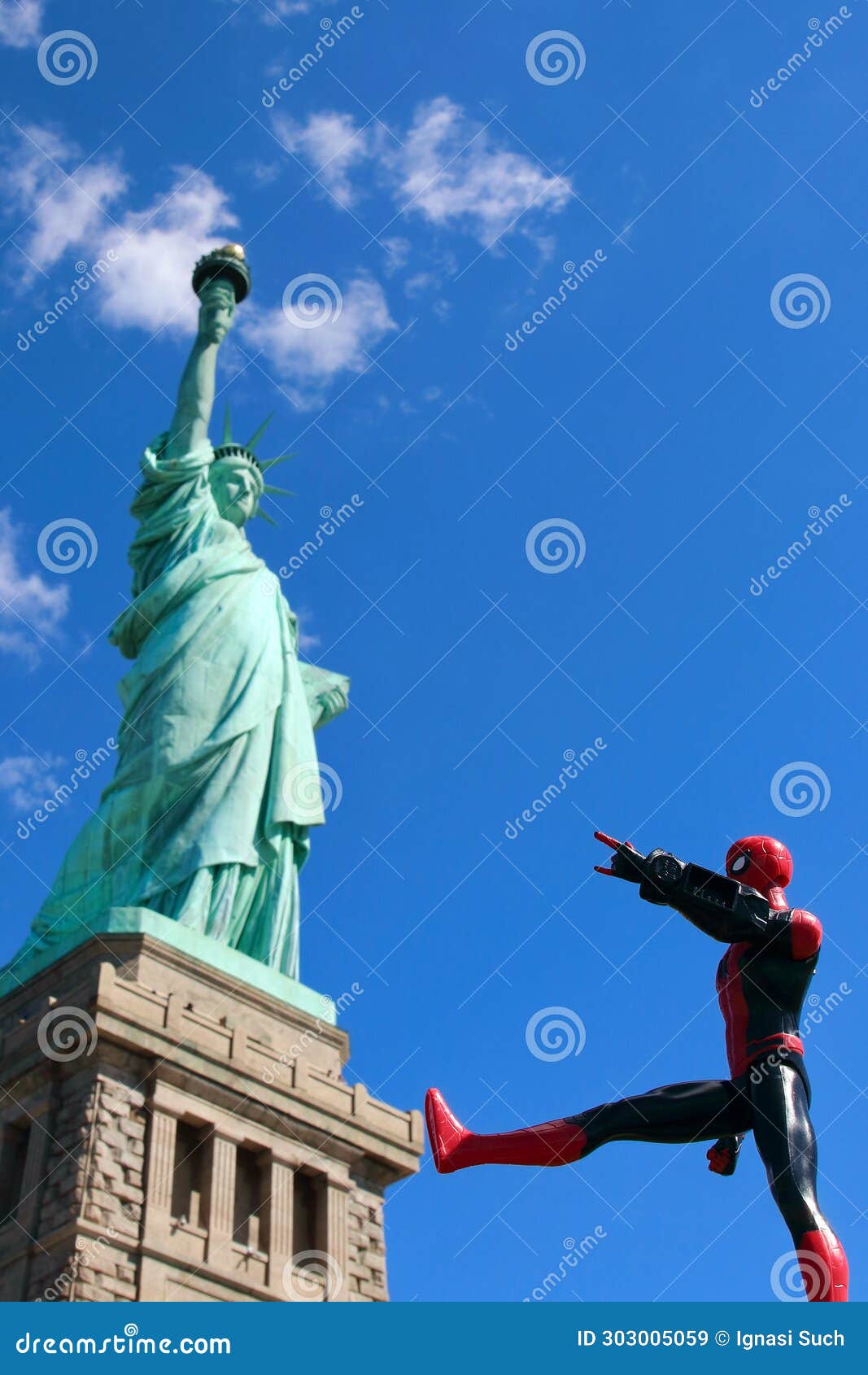 Spiderman Superhero Faces the Statue of Liberty in NYC Editorial Stock