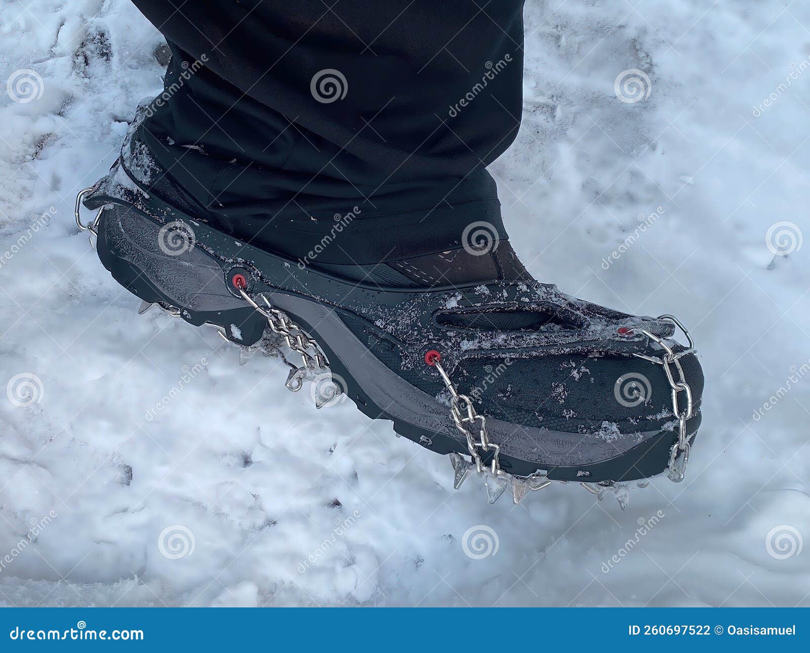 An Spike Ice Cleats or Crampons for Walking Hiking Fishing Safety Traction  Cleats Snow Ice Grips on a Winter Stock Photo - Image of pair, limb:  260697522