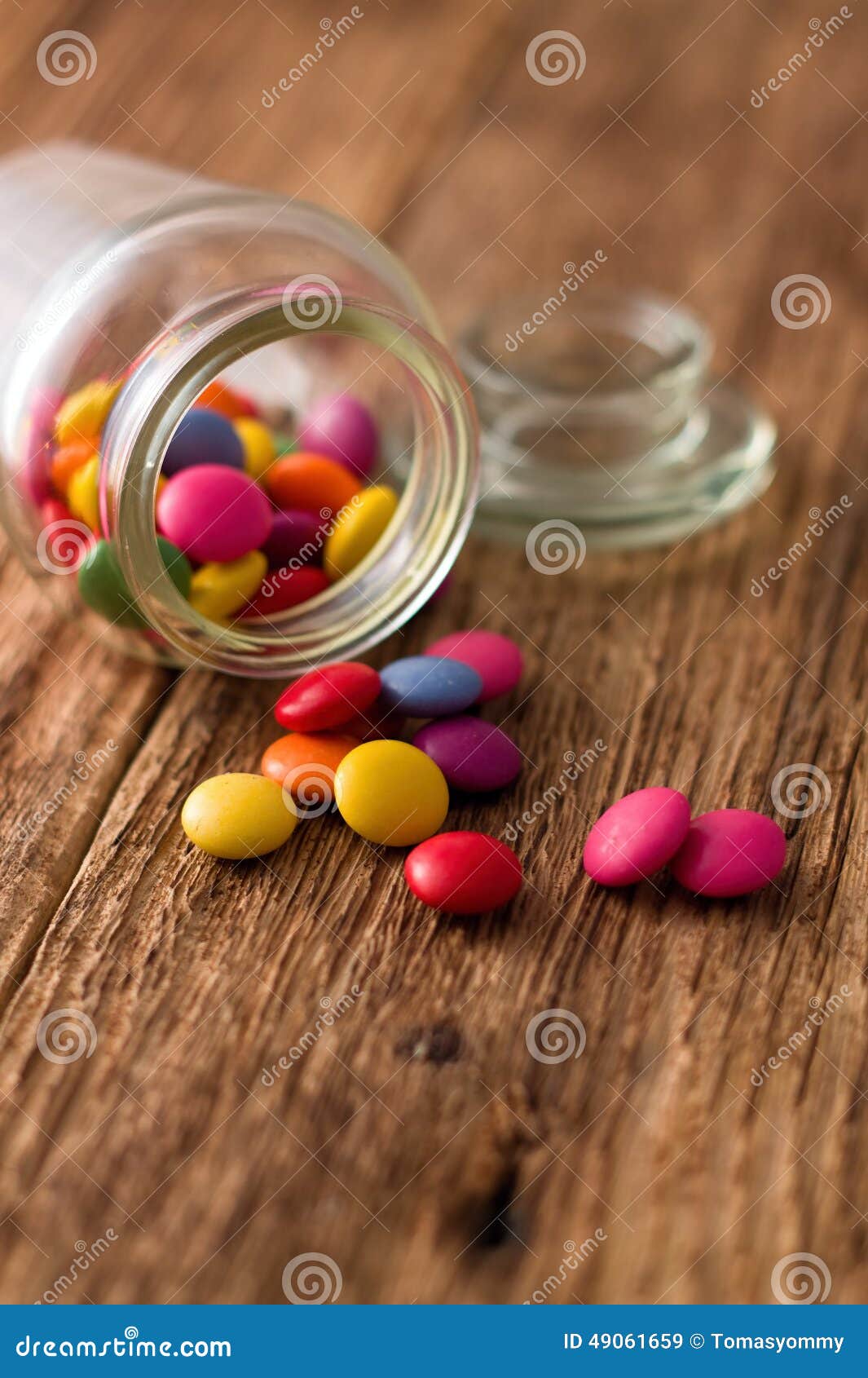 Spilled Chocolate Smarties Around Glass Jar Stock Image - Image of ...