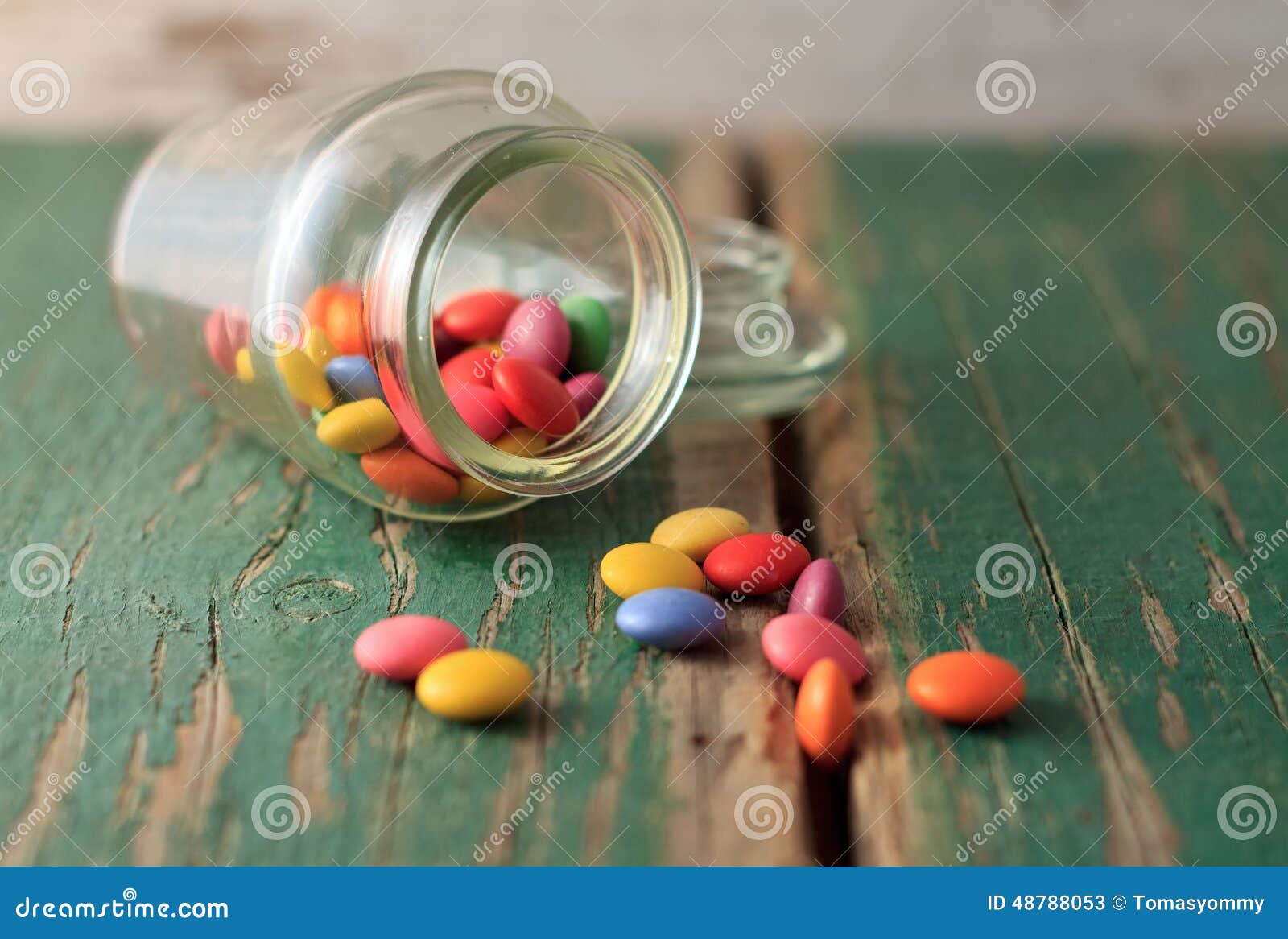 Spilled Chocolate Smarties on Green Wooden Board Stock Image - Image of ...