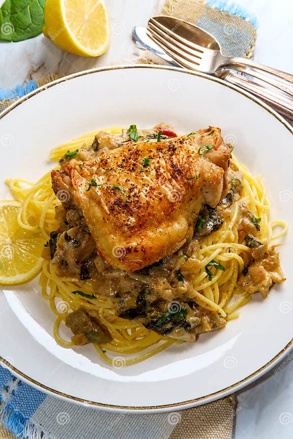 Spinach Artichoke Chicken Thighs Stock Photo - Image of parsley, creamy