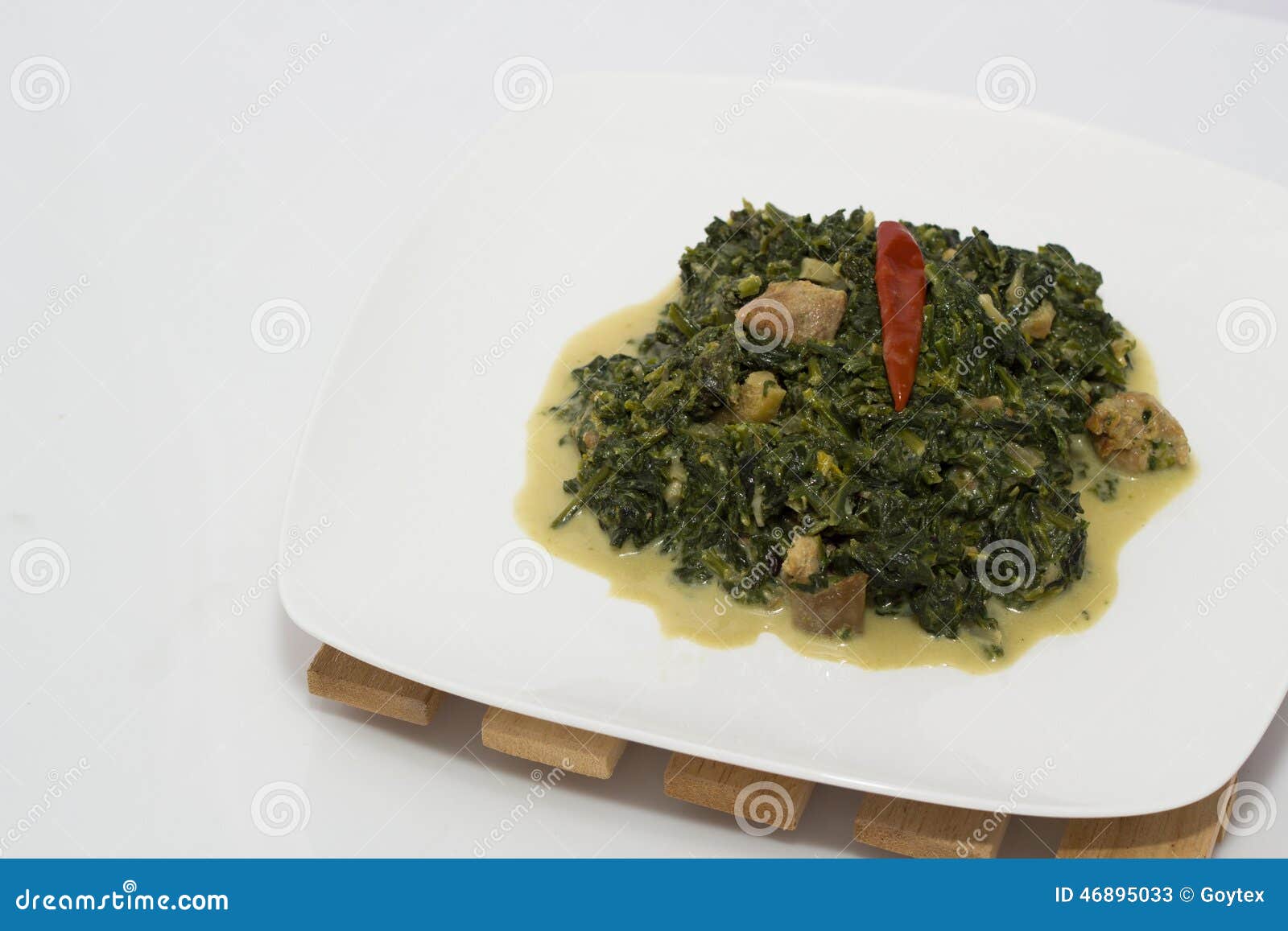 Spinach with coconut milk stock image. Image of wood - 46895033
