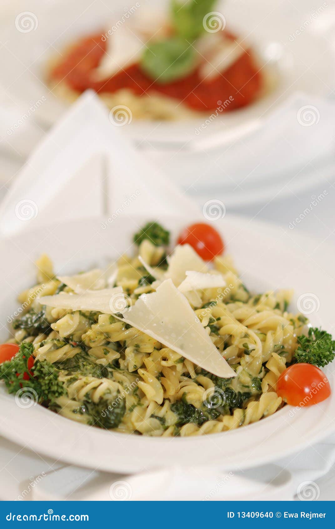 Spinach fussili. Pasta fussili with spinach and sauce of white wine and cheese