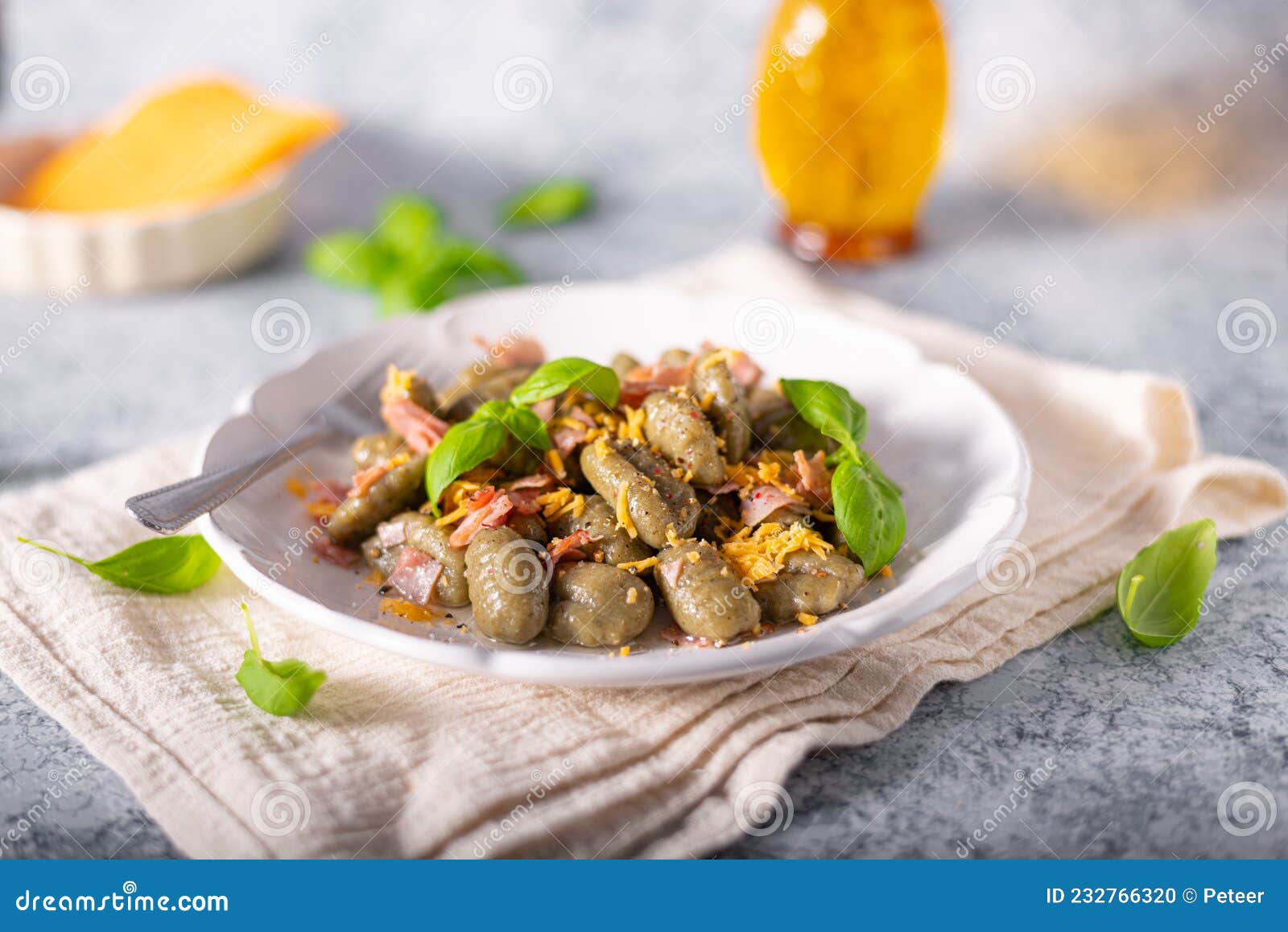 Spinach gnocchi with ham stock photo. Image of dish 232766320