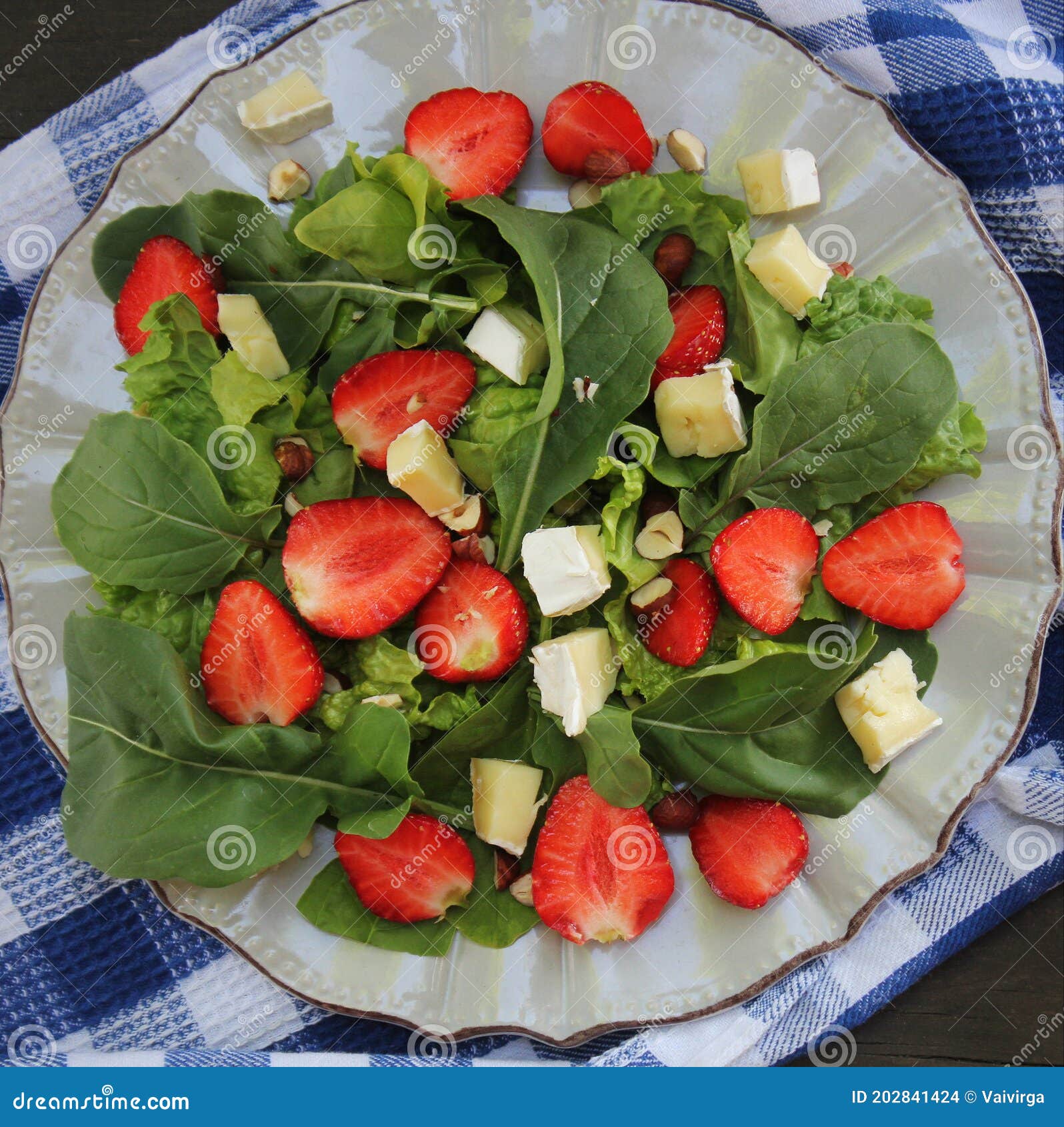 Spinach Salad with Strawberries,goat`s Cheese and Nut Stock Photo