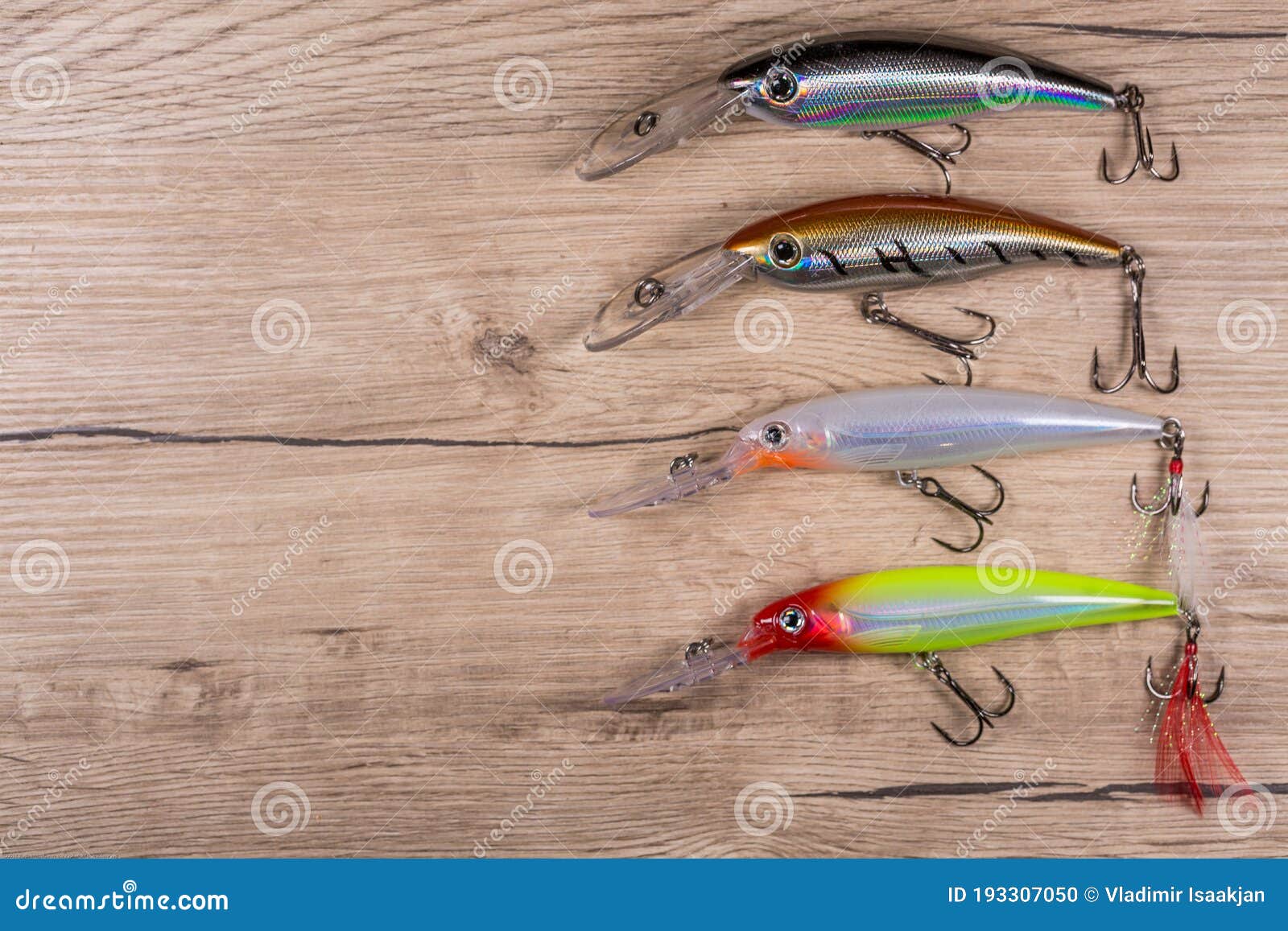 Spinner Lures and Fishing Floats on Wooden Desk Stock Photo