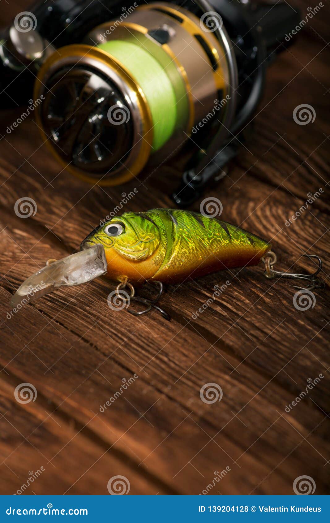 Spinning with a Reel on an Old Brown Wooden Background. Fishing Lure.  Plastic Bright Green Wobbler. Beautiful Relief Boards Stock Photo - Image  of brown, lures: 139204128