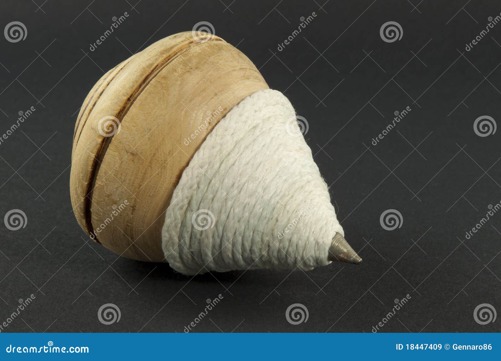 Spinning top on black stock image. Image of crack, move 18447409