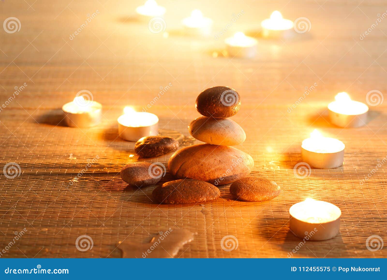 spiritual purity atmosphere with oil lamps in temple. stone bala