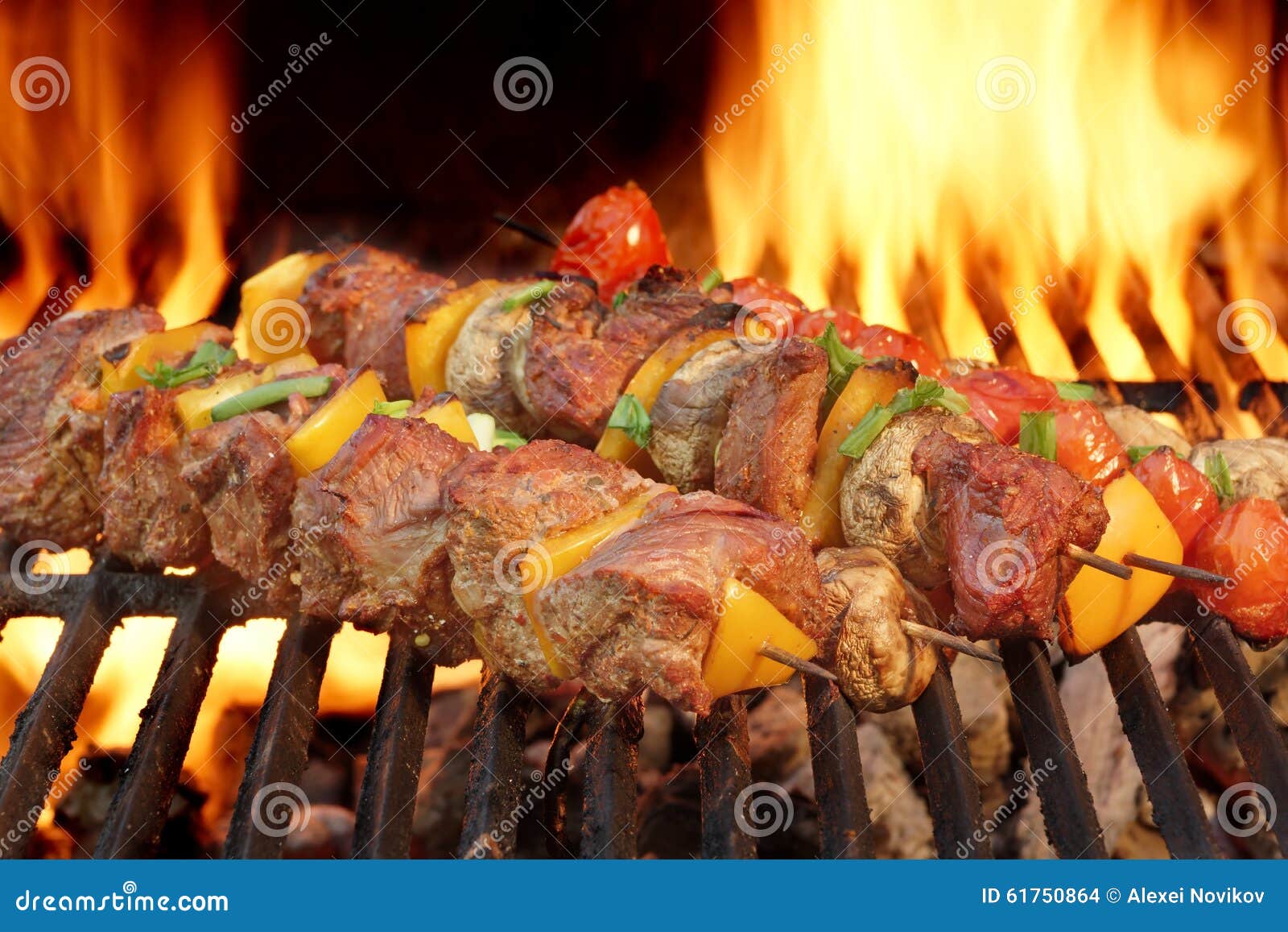 spit roast beef kebabs on the hot flaming bbq grill