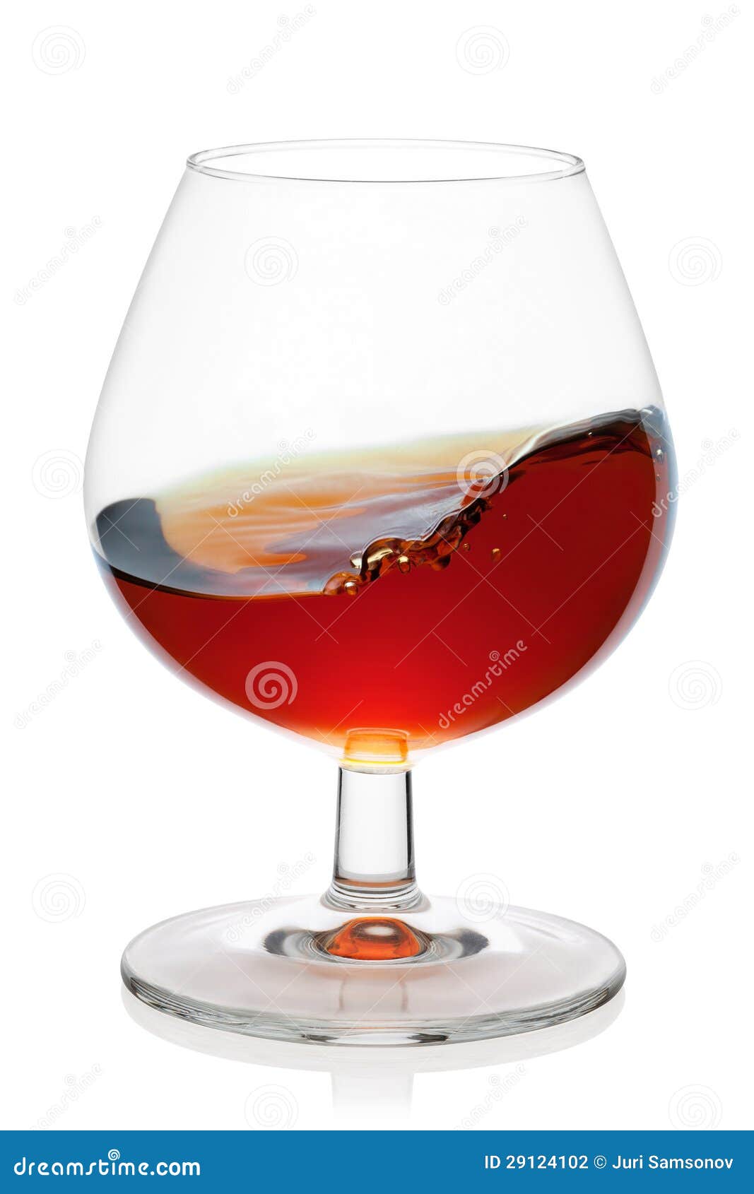 Splash Of Cognac In Snifter Glass. Stock Photo Image of elegance
