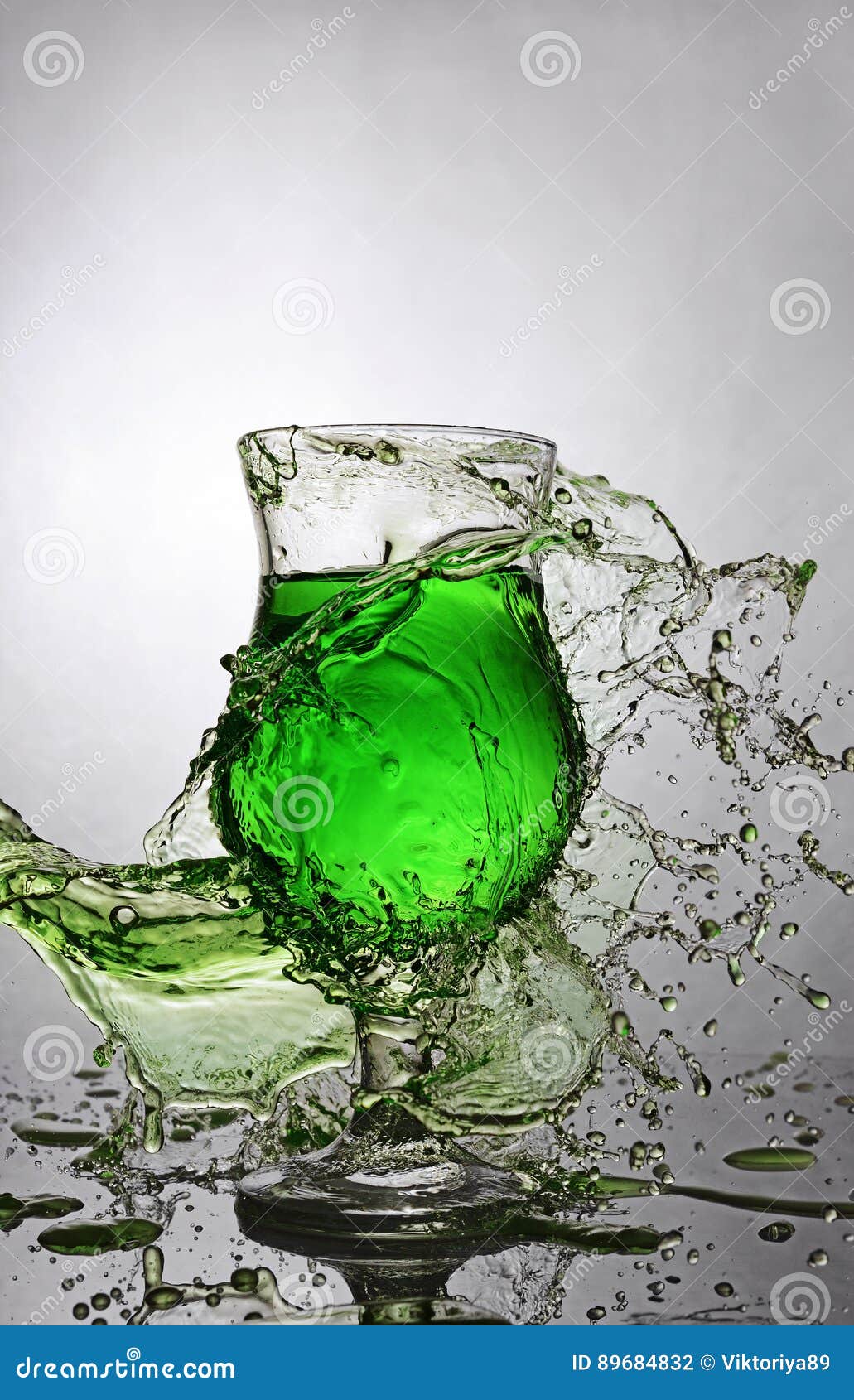 Splash in Glass of Green Alcoholic Cocktail Drink Stock Photo Image