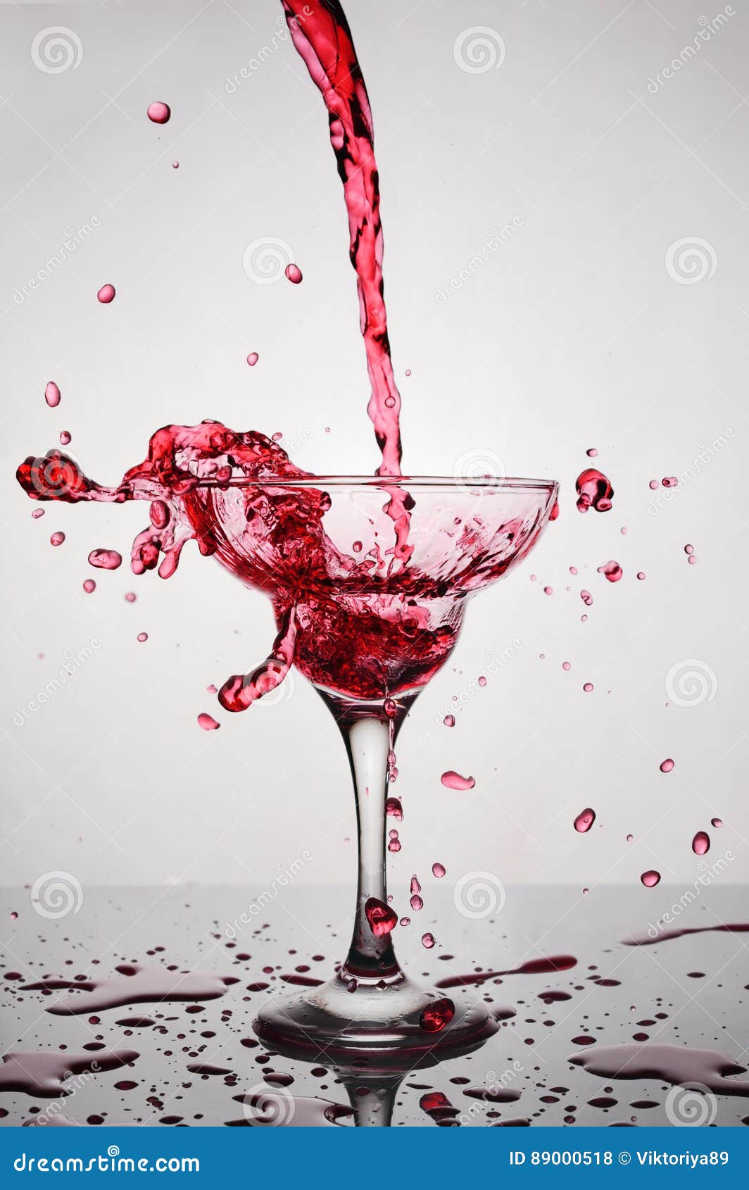 Splash in Glass of a Pink Alcoholic Cocktail Drink Stock Photo Image