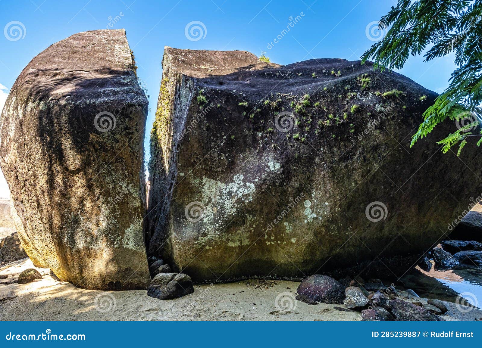 splitted stone at abraao preta beach on big island ilha grande in angra dos reis, rio de janeiro, brazil