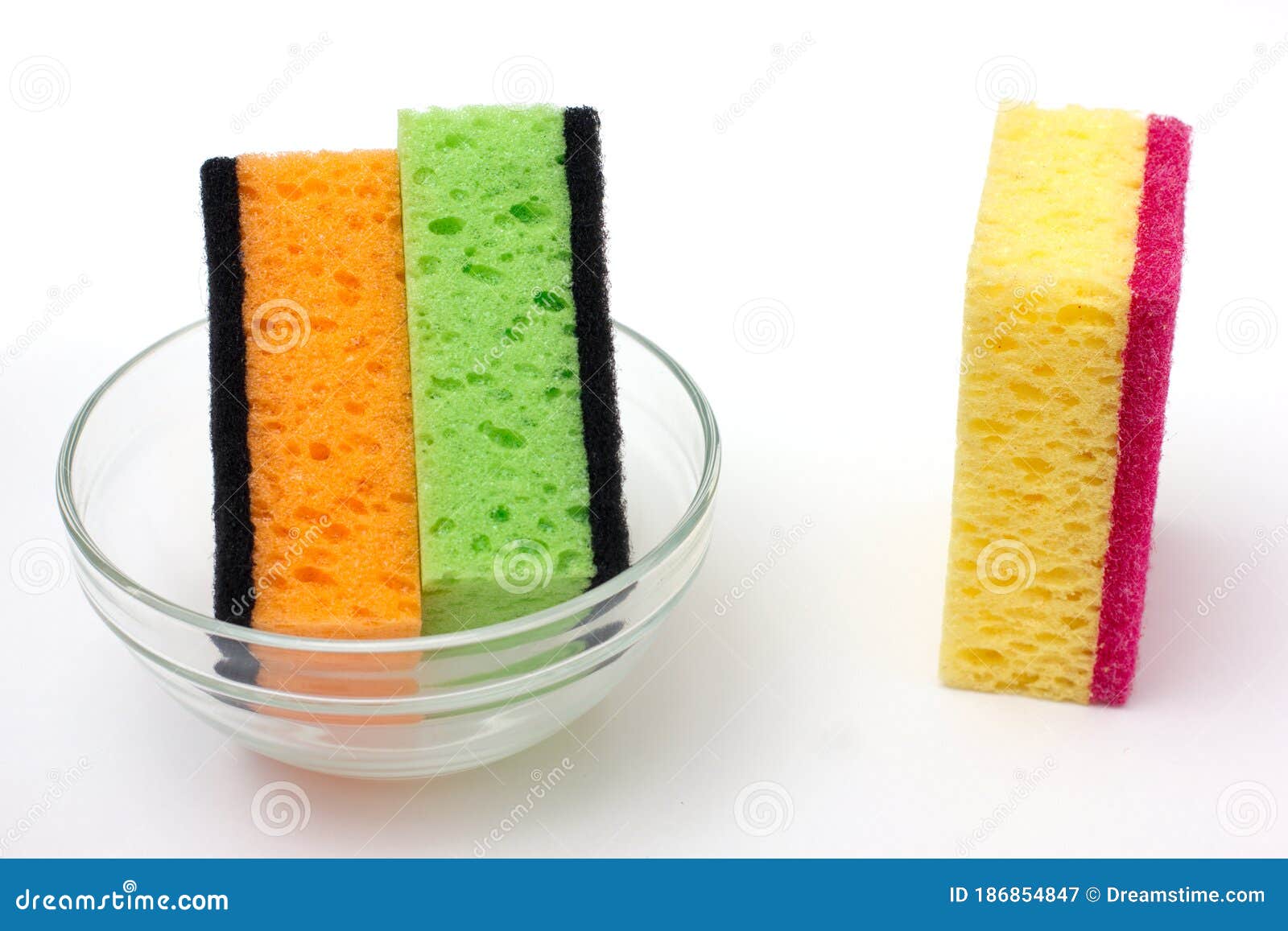 Sponges for Washing Dishes on a White Background with a Plate Stock